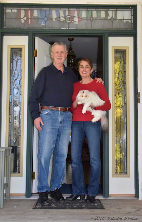 john and susan at front door of their home